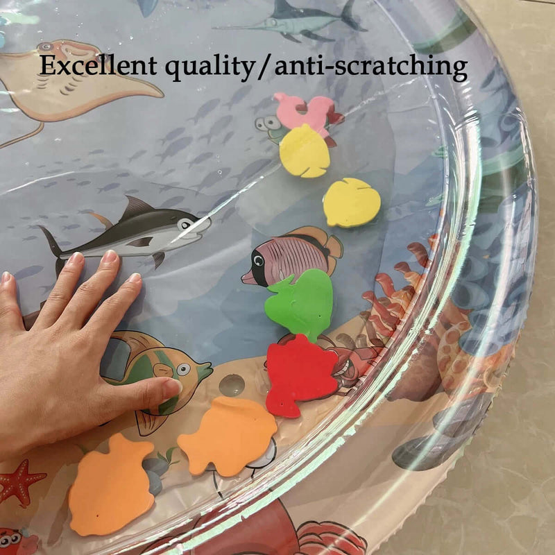 Hand touching water pad with colorful fish shapes and text stating Excellent quality/anti-scratching