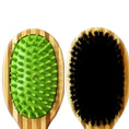 Load image into Gallery viewer, Bamboo double-sided pet grooming brush with a rubber and bristle side for effective grooming and deshedding.
