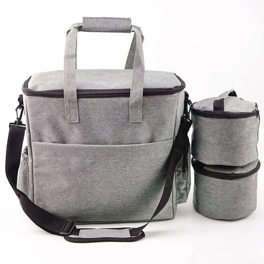 Gray waterproof pet travel bag with spacious compartments and detachable food container for stress-free outings.