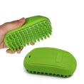 Load image into Gallery viewer, Comfort Pet Grooming Brush held in hand, showcasing soft ergonomic design for easy pet grooming and massaging.
