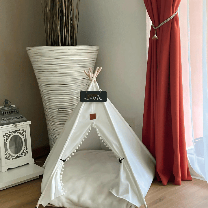 Pet Teepee Tent Indoor Puppy House & Cat Bed by Littlepawgive in a stylish room with red curtains and modern decor.