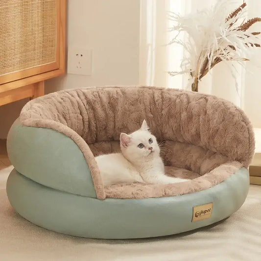 Cozy cat lounging in a plush Comfort Four Seasons Pet Sofa Bed, designed for year-round comfort and style.