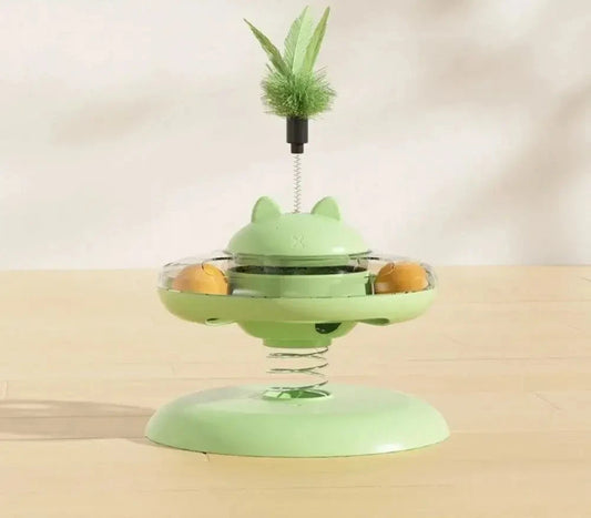 Interactive green cat toy with a spring and leafy toy, providing endless fun for your feline friend.