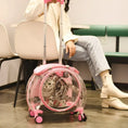 Load image into Gallery viewer, Transparent cat trolley case with pink accents, showcasing a cat inside. Multi-purpose pet carrier for stylish and convenient travel.
