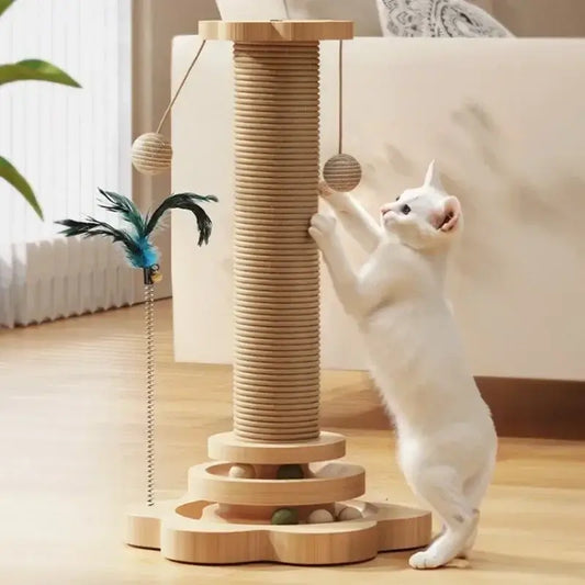 Cat playing with a sisal scratching post featuring toys and a sturdy base in a bright, cozy room.