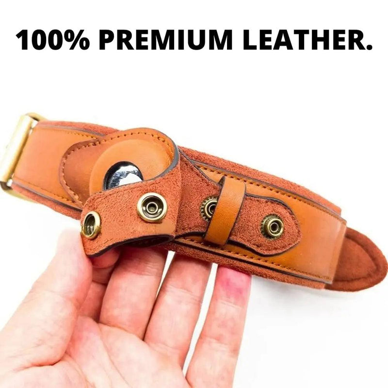 Heavy-duty leather dog collar with Airtag holder for ultimate pet safety, premium leather construction, held by a hand with text "100% Premium Leather"