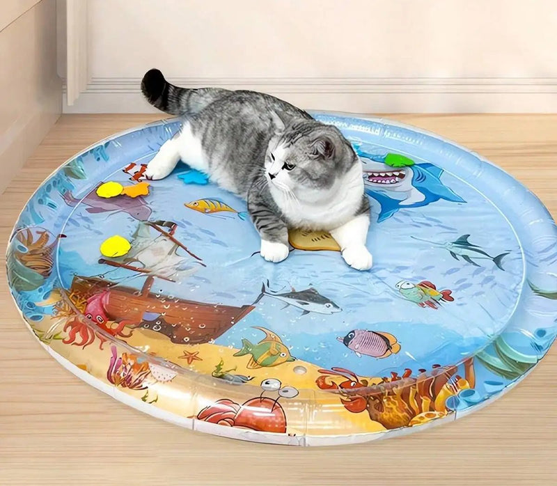 Cat relaxing on Summer Cooling Pet Water Bed from LittlePawGive featuring ocean-themed design perfect for keeping pets cool and comfortable